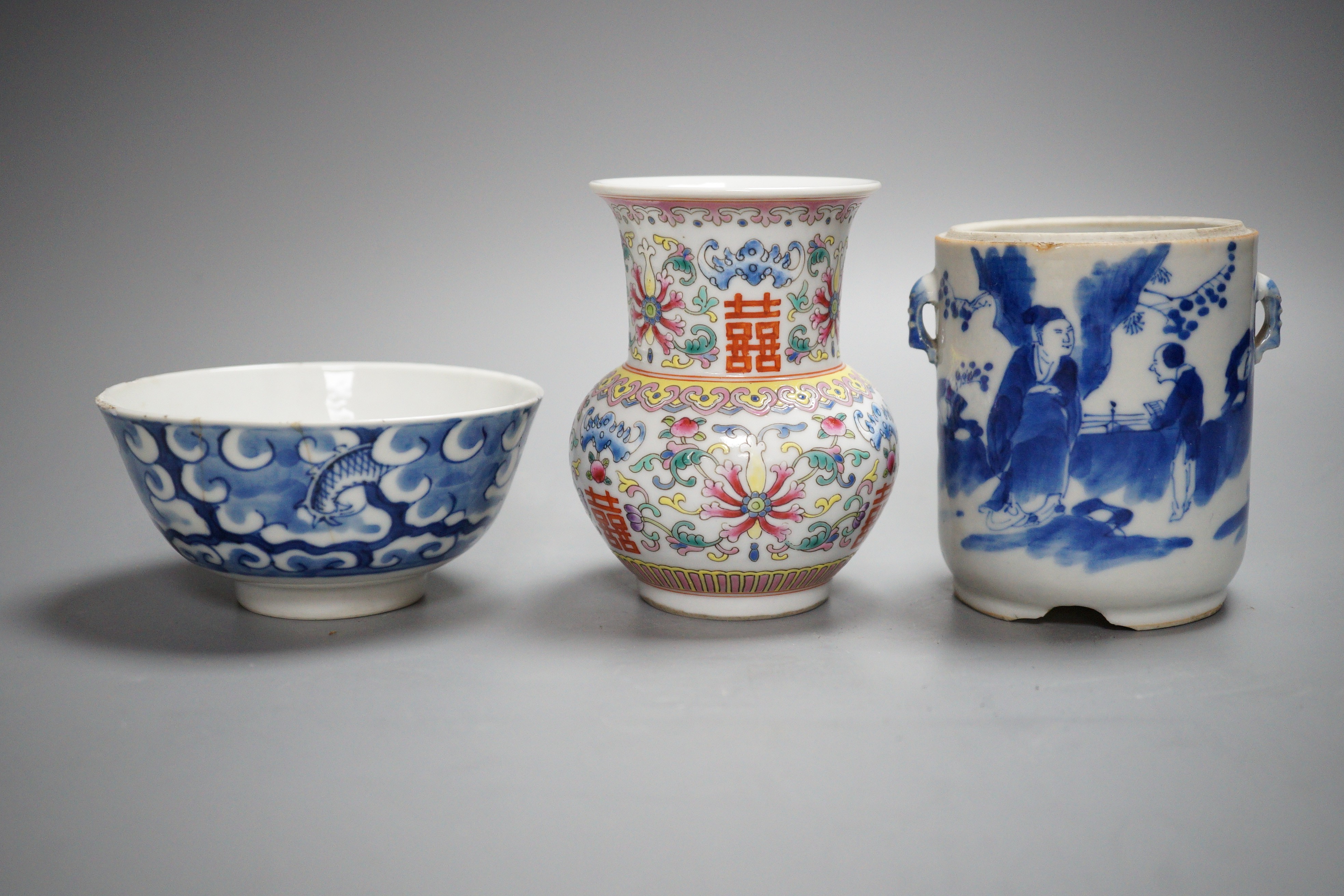 An early 20th century Chinese famille rose vase, a Chinese blue and white jar, lacking cover and a blue and white bowl